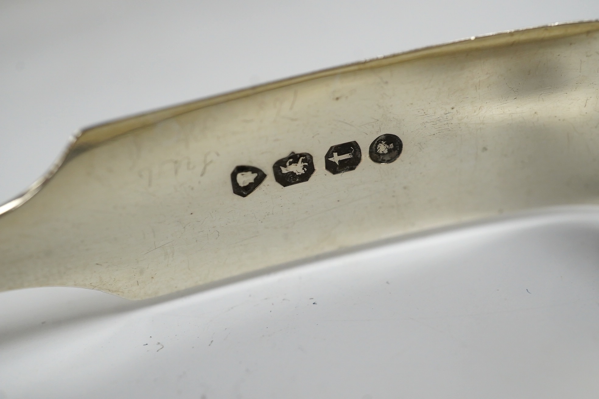 Two pairs of 19th century silver sugar tongs, including London, 1803 and a silver bonbon dish. Condition - fair to good